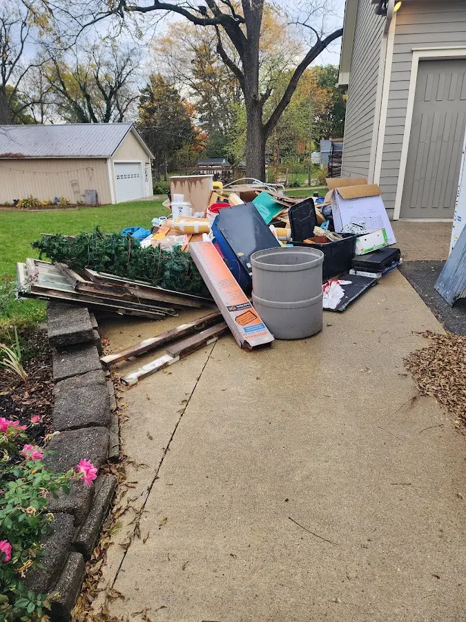 Dumpster being loaded with debris for Commercial Dumpster Rental in Cocoa West